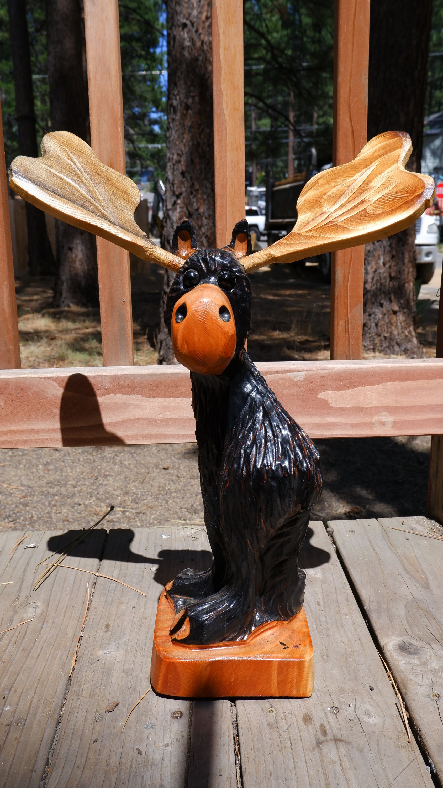 Wood carved Booty Moose chainsaw art — The Bear's Den