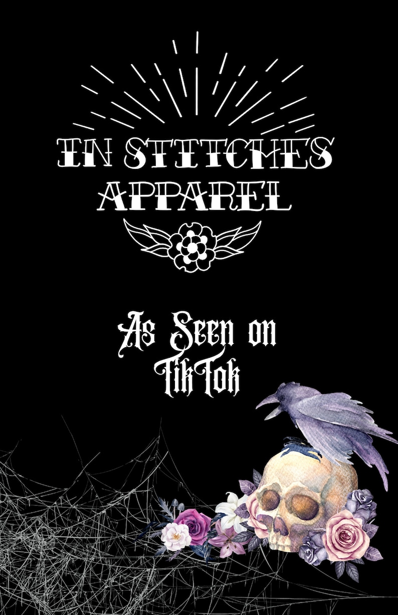 May include: A black and white graphic design featuring the text "In Stitches Apparel" and "As Seen on Tik Tok". The design also includes a skull with a crow perched on top, surrounded by flowers and spiderwebs.