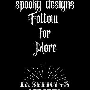 May include: Black and white graphic with the text "Over 100 spooky designs Follow for More" in a gothic font. Below the text is a stylized sunburst with the text "In Stitches Apparel" and a small flower.