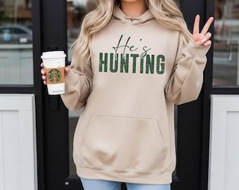 He’s hunting sweatshirt, deer season shirt for woman, shopping wife group, hunters wives