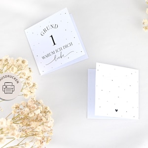 May include: Two printable cards with black text on a white background. The first card says "Grund 1 Warum ich dich liebe" and the second card has a small black heart.