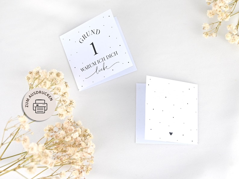 May include: Two printable cards with black text on a white background. The first card says "Grund 1 Warum ich dich liebe" and the second card has a small black heart.