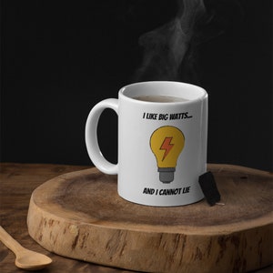 White mug featuring cartoon bulb and lightning bolt