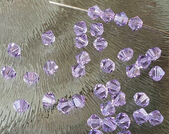 Swarovski crystal bicone kraaltjes 4 mm, violet, per 20 stuks