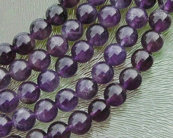 Amethyst kraal, paars gewolkt, rond 10 mm, per 10 stuks