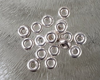 Silver bead round donut 5 mm, per 10 pieces