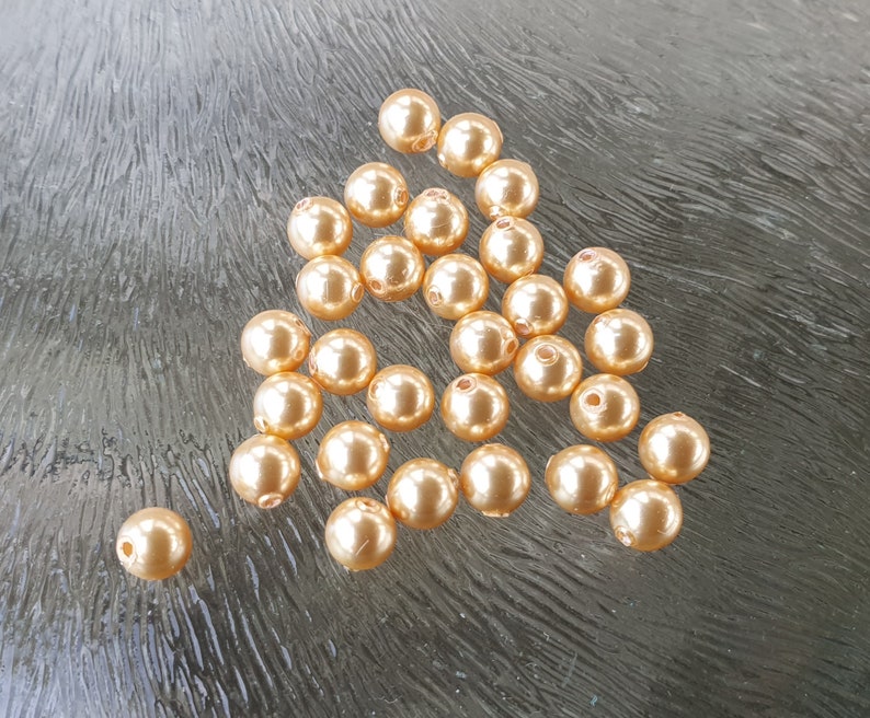 Swarovski parels goudkleurig, gold, 4 mm, per 50 stuks afbeelding 1