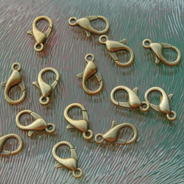 Bronze coloured metal cartier locks, 12 mm, matt, per 20 pieces