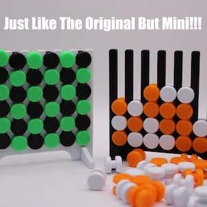 May include: A miniature version of the classic Connect Four game. The game board is black and white with green and orange game pieces. The text "Just Like The Original But Mini!!!" is printed on a white background.