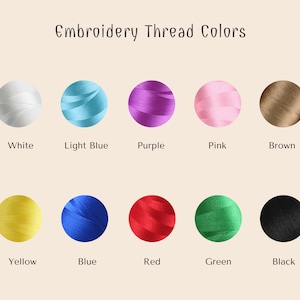 May include: Embroidery thread colors in a variety of colors, including white, light blue, purple, pink, brown, yellow, blue, red, green, and black.