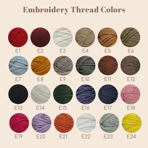 May include: A color chart of embroidery thread options. The image displays 24 different thread colors arranged in a grid, each labeled with a number. The colors range from red and black to blue and yellow, with the text "Embroidery Thread Colors" at the top.