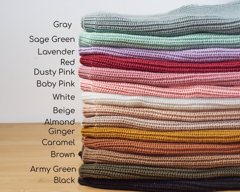 May include: A stack of knitted fabric in various colors, including gray, sage green, lavender, red, dusty pink, baby pink, white, beige, almond, ginger, caramel, brown, army green, and black. The text on the left lists the colors.