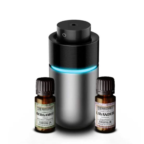 Portable Mini USB Car Air Humidifiers Ultrasonic Essential Oil Diffuser, with two bottles of 10ml essential oils.