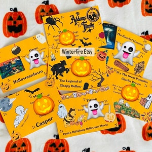 May include: A set of 10 Halloween-themed printable cards featuring various characters and movie titles. The cards are yellow with orange and black accents. The cards feature images of ghosts, pumpkins, and other Halloween characters. The text on the cards includes "Halloweentown", "The Legend of Sleepy Hollow", "The Addams Family", "The Haunted Mansion", "It's The Great Pumpkin Charlie Brown", and "Pooh's Heffalump Halloween Movie".