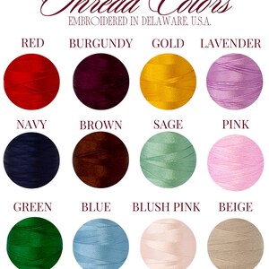 May include: A color chart titled Thread Colors Embroidered in Delaware, U.S.A. featuring twelve circular thread samples in red, burgundy, gold, lavender, navy, brown, sage, pink, green, blue, blush pink, and beige with the text Need a different color? Message us!