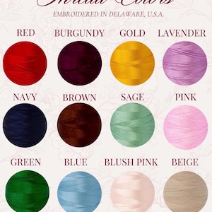 May include: A color chart titled Thread Colors, Embroidered in Delaware, U.S.A. featuring twelve circular thread samples in red, burgundy, gold, lavender, navy, brown, sage, pink, green, blue, blush pink, and beige with the text Need a different color? Message us!