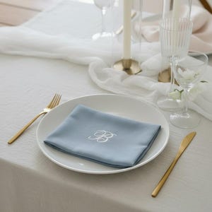 embroidered linen napkin personalized monogram napkin wedding table decor luxury dinner table napkin display custom last name initial napkin embroidered cloth napkin wedding reception tablescape bridal shower table decor baby shower table setting thanksgiving dinner table decor christmas dining table napkins housewarming gift personalized home decor wedding gift newlywed gift rehearsal dinner table display elegant linen napkins hostess gift custom embroidered napkins heirloom table linen luxury
