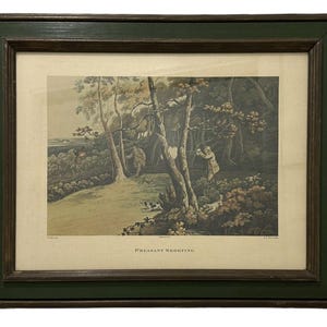 May include: A framed print of a vintage illustration depicting a pheasant shooting scene. The image shows two hunters in a wooded area, with one aiming a gun at a pheasant in flight. The print is titled "Pheasant Shooting" and is framed in a dark green frame.