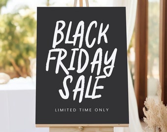 May include: Black chalkboard sign on an easel with white text that reads "Black Friday Sale Limited Time Only".