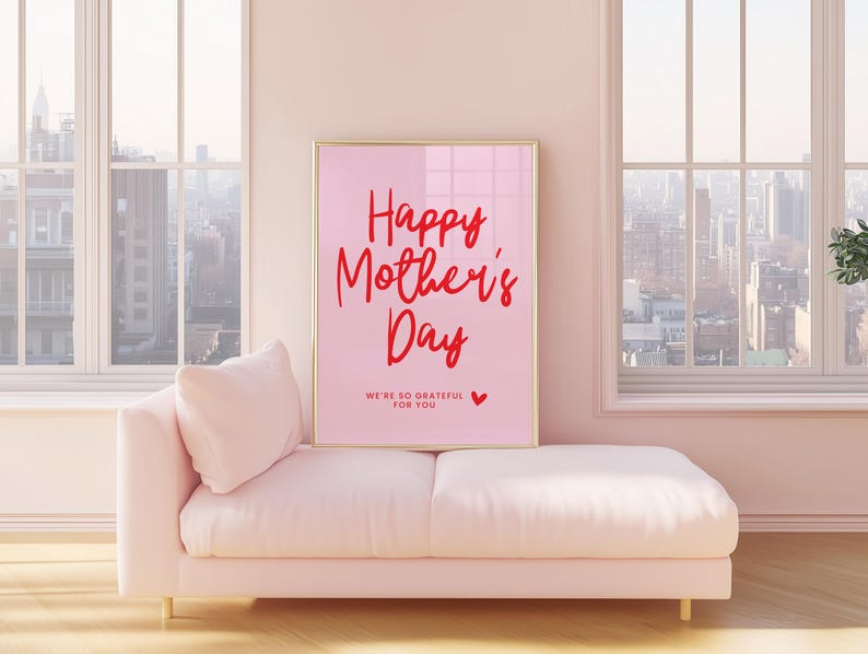 May include: A pink framed poster with the text "Happy Mother's Day" in red script. The poster also includes the text "We're so grateful for you" in smaller red text with a small red heart.