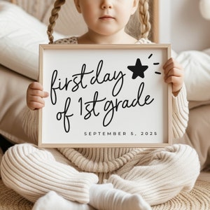 May include: A child is holding a sign that reads "first day of 1st grade" with a star and the date September 5, 2025.