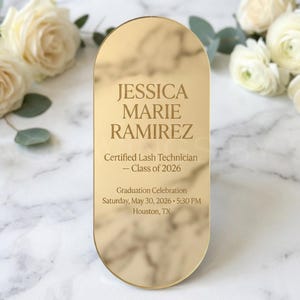 May include: A gold-toned, oval-shaped graduation announcement with the name "JESSICA MARIE RAMIREZ" and details for a graduation celebration. The announcement includes the text "Certified Lash Technician - Class of 2026".