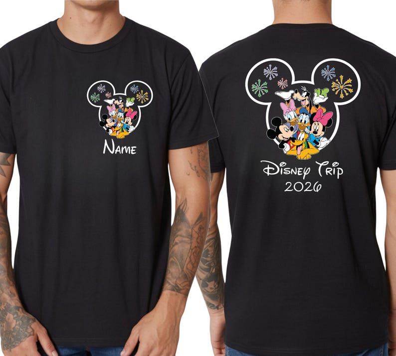 A black t-shirt with a Disney-themed design featuring Mickey Mouse and Minnie Mouse characters, along with the text "Disney Trip 2020" printed on the back.