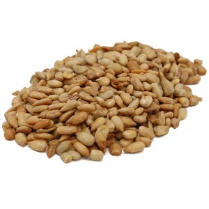 May include: A close-up view of a pile of roasted sunflower seeds. The seeds are a light brown color and have a slightly rough texture.