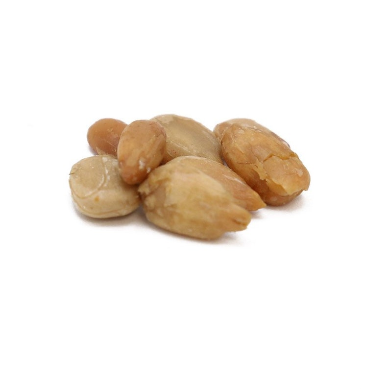 May include: A close-up of a pile of light brown, dried sunflower seeds.