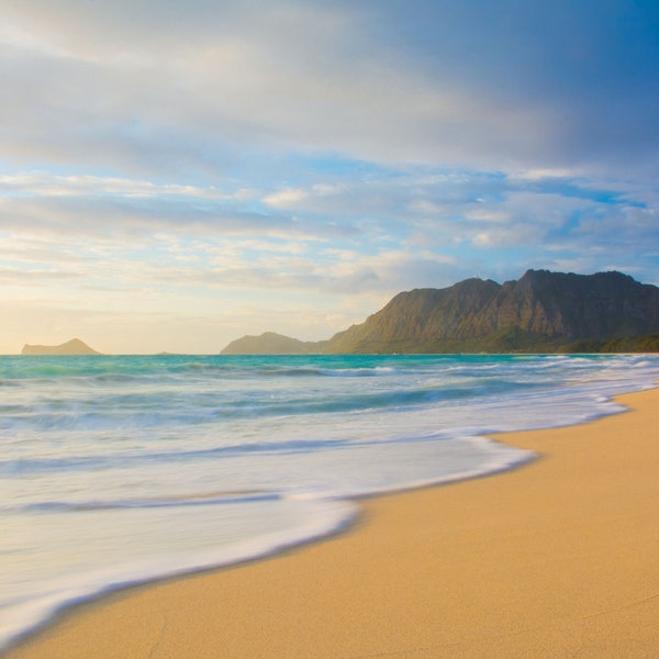 Coastline with waves at sunrise on the beach at Waimanalo on the windward side of Oahu in Hawaii. Digital download.