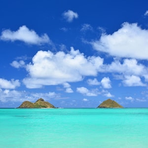 Mokulua Islands off Lanikai Beach in Kailua with turquoise waters on the Island of Oahu in Hawaii. Digital download.
