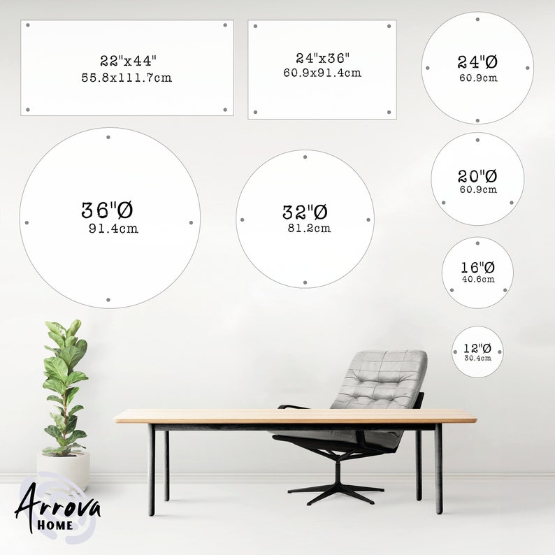 May include: A white wall with various sizes of round mirrors with black outlines and measurements in inches and centimeters. The mirrors are arranged in a grid pattern. There is a wooden table and a gray chair in the foreground.