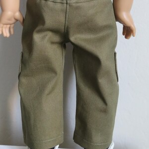 May include: Olive green cargo pants with a straight leg fit and two side pockets. The pants are made of a soft, durable fabric and are perfect for everyday wear.
