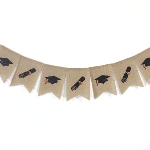 May include: A burlap banner with alternating graduation caps and diplomas printed on each flag. The banner is strung with twine and is perfect for a graduation party.
