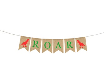May include: A burlap banner with the word "ROAR" in green letters and red dinosaur silhouettes on each end.
