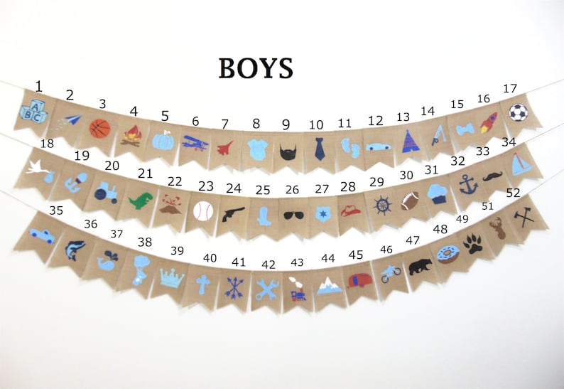 May include: A burlap banner with 52 flags, each with a different blue, red, or black icon. The flags are numbered 1 through 52. The banner says "BOYS" at the top.