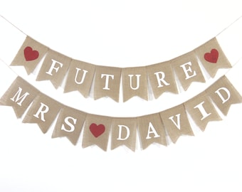 May include: A burlap banner with the text "FUTURE MRS DAVID" in white letters. The banner has red hearts between the words.