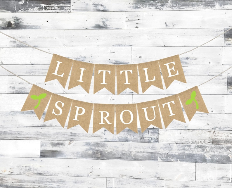 May include: A burlap banner with green leaf accents reads "Little Sprout".