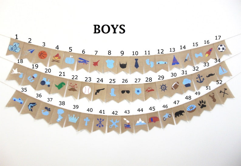 May include: A burlap banner with 52 flags, each with a different blue, red, or black icon. The flags are numbered 1 through 52. The banner says "BOYS" at the top.