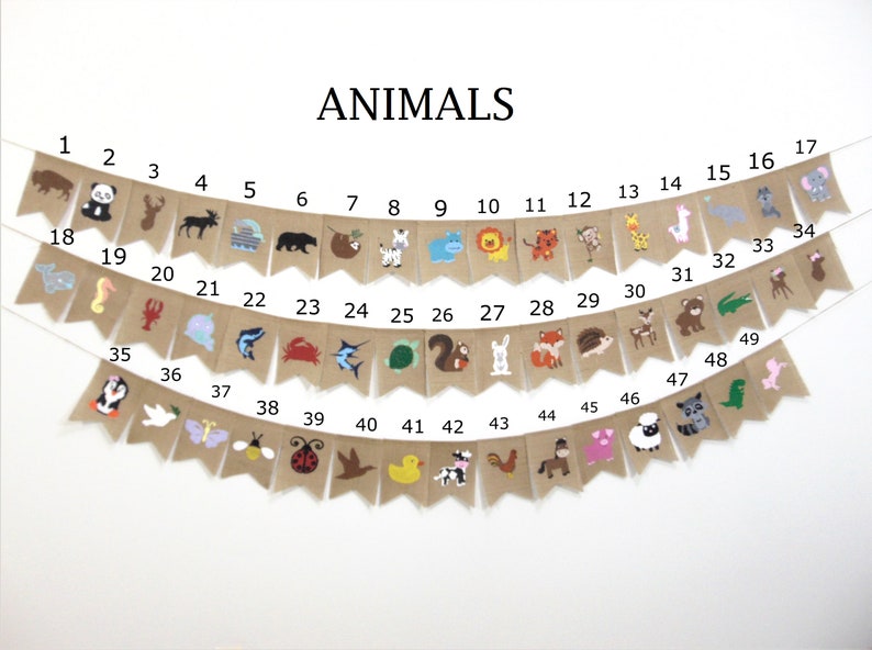 May include: A burlap banner with the word "ANIMALS" printed in black at the top. The banner is decorated with 49 different animal illustrations, each numbered from 1 to 49. The animals include a panda, a deer, a moose, a bear, a sloth, a zebra, a hippopotamus, a lion, a tiger, a monkey, a giraffe, a llama, an elephant, a seahorse, a lobster, a unicorn, a shark, a crab, a turtle, a squirrel, a rabbit, a fox, a hedgehog, a fawn, a bear, an alligator, a spider, a penguin, a dove, a butterfly, a bee, a ladybug, a bird, a duck, a cow, a rooster, a horse, a pig, a sheep, a raccoon, and a dinosaur.