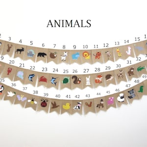 May include: A burlap banner with the word "ANIMALS" printed in black at the top. The banner is decorated with 49 different animal illustrations, each numbered from 1 to 49. The animals include a panda, a deer, a moose, a bear, a sloth, a zebra, a hippopotamus, a lion, a fox, a giraffe, a llama, an elephant, a seahorse, a lobster, a unicorn, a shark, a crab, a turtle, a squirrel, a rabbit, a fox, a hedgehog, a deer, a bear, an alligator, a spider, a penguin, a dove, a butterfly, a bee, a ladybug, a bird, a duck, a cow, a rooster, a horse, a pig, a sheep, a raccoon, and a dinosaur.