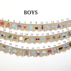 May include: A burlap banner with 52 flags, each with a different blue, red, or black icon. The flags are numbered 1 through 52. The banner says "BOYS" at the top.