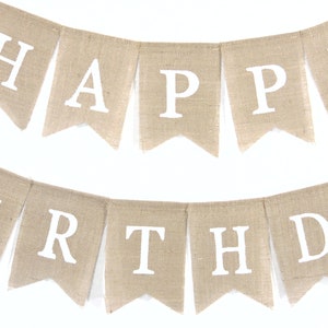 May include: A burlap banner with the words "Happy Birthday" in white letters.