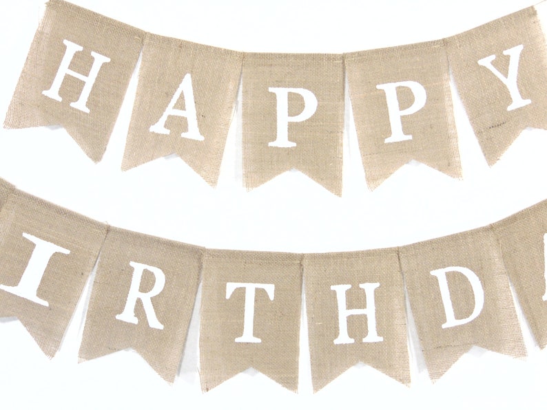 May include: A burlap banner with the words "Happy Birthday" in white letters.