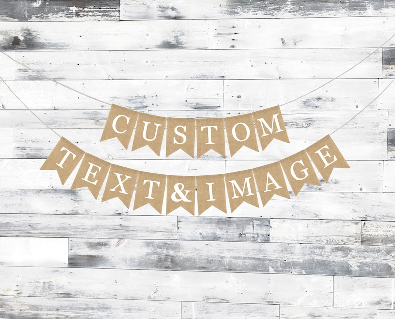 May include: A burlap banner with the text "CUSTOM TEXT & IMAGE" in white letters. The banner is strung on a white string and is hanging against a white wood background.