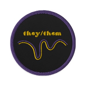 May include: A black and purple circular patch with the text "they/them" in yellow lettering and a yellow and purple wavy line.