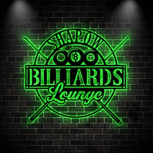 May include: A circular black metal wall sign with bright green LED backlighting. The design features two crossed pool cues, three billiard balls with an eight ball in the center, and the text SHAPOW BILLIARDS Lounge in a bold, stylized font.