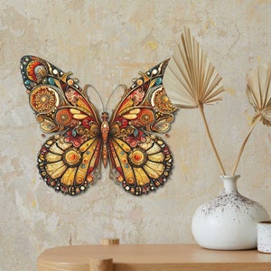 May include: A decorative butterfly wall art with intricate details in shades of gold, red, and blue. The butterfly is made of a textured material and has a 3D effect.