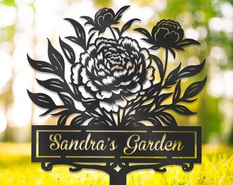 May include: Black metal garden sign with a floral design and the text "Sandra's Garden".