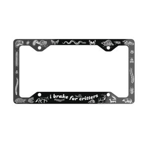 May include: Black license plate frame with white illustrations of various animals and insects. The text "i brake for critters" is printed in white. The frame has a rectangular shape with rounded corners.